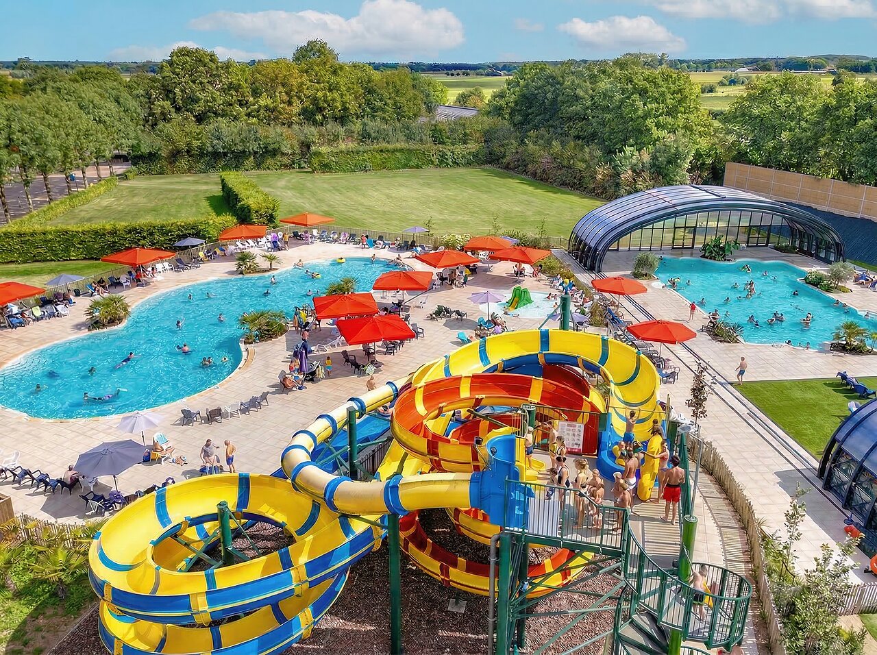 Giant water slides and outdoor/indoor pools at CAPFUN IJsselstrand campsite in Doesburg.