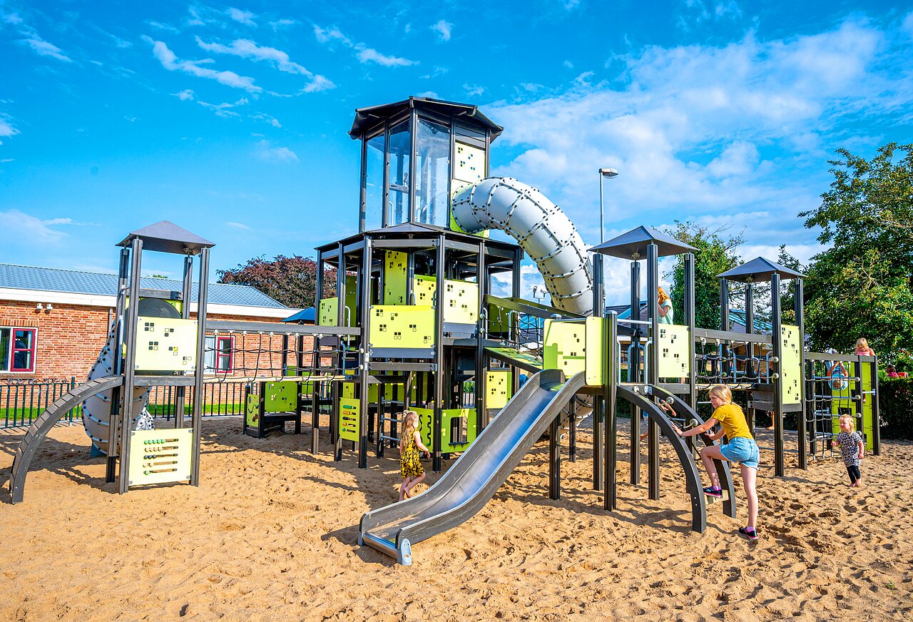 Large playground with slides and climbing structures at CAPFUN IJsselstrand campsite in Doesburg.