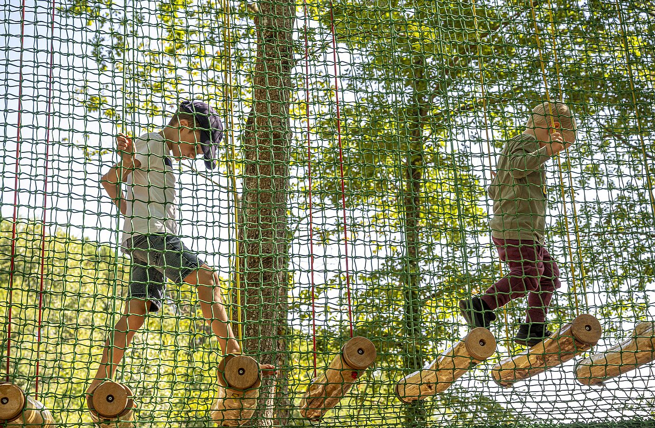 Children on a high ropes adventure course at CAPFUN Joncal campsite in Grandcamp - Maisy (14).