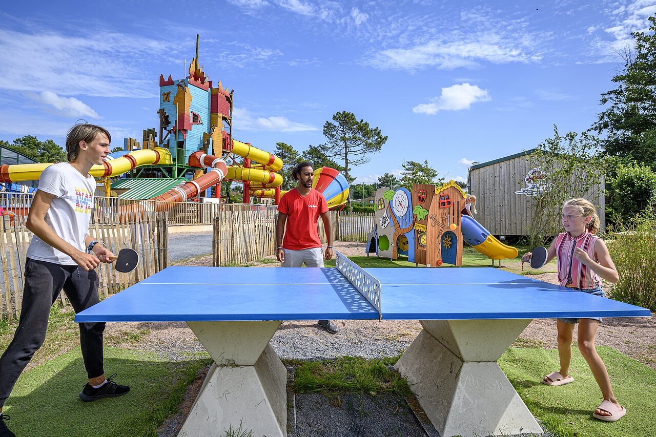 Children playing ping-pong, giant water slides at CAPFUN Joncal campsite in Grandcamp - Maisy (14).
