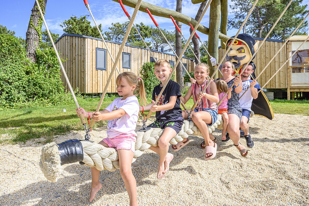 Children and mascot on swing, Mobil-homes at CAPFUN Joncal in Grandcamp - Maisy (14).