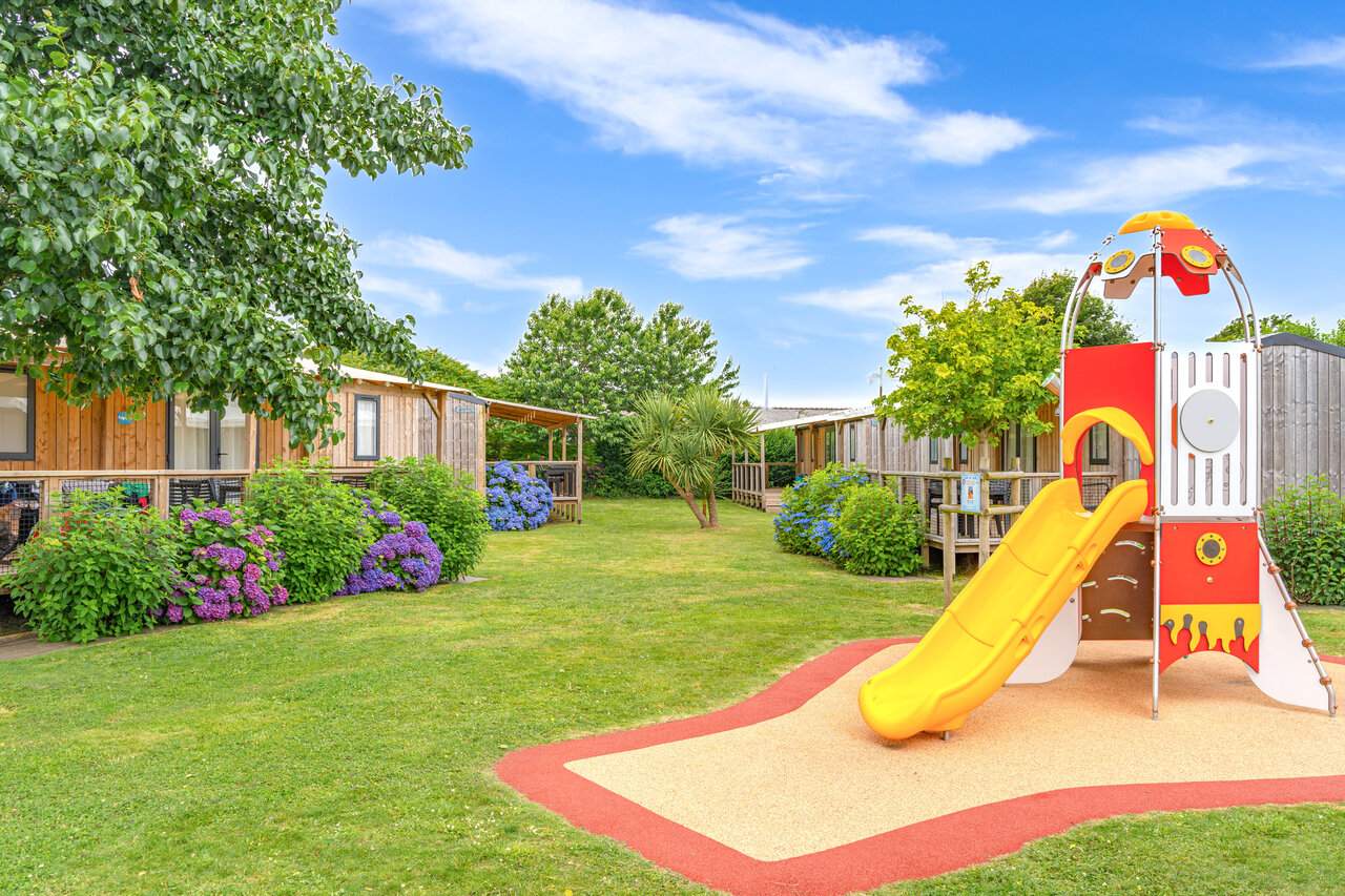 Colorful playground, slide, mobile homes at CAPFUN Kervel campsite (29).