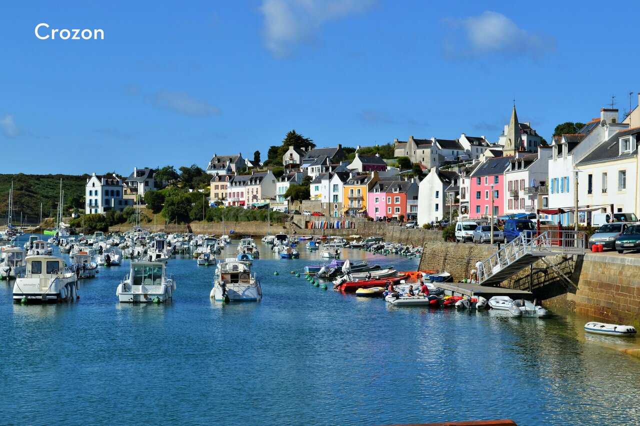 Crozon harbor with colorful houses and boats, a place to visit in Brittany.