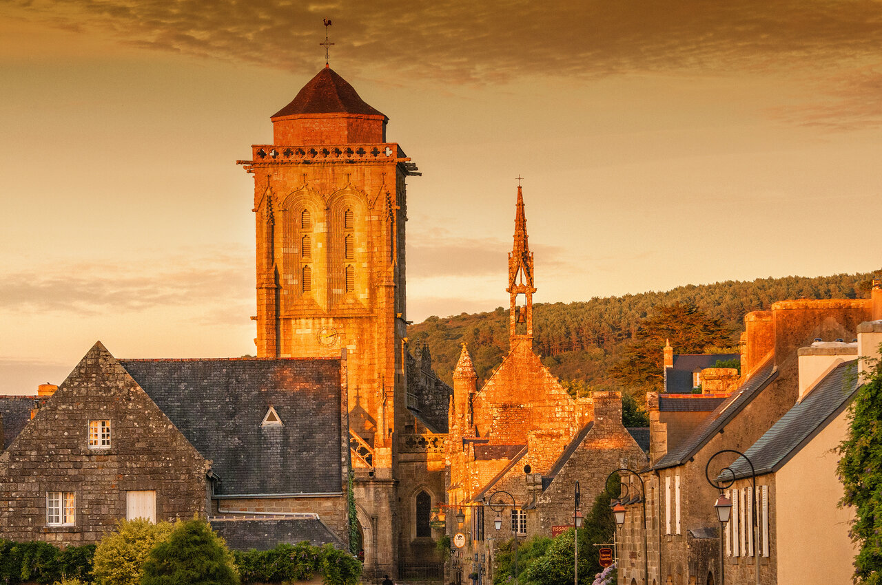 Historic Breton village with old church, stone houses near Plonevez Porzay.