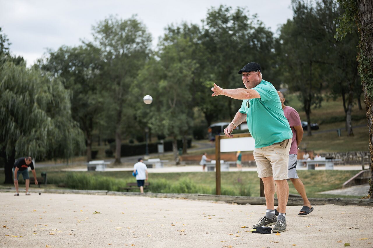 Petanque game on court at camping CAPFUN Lac des 3 Vall�es � Lectoure.