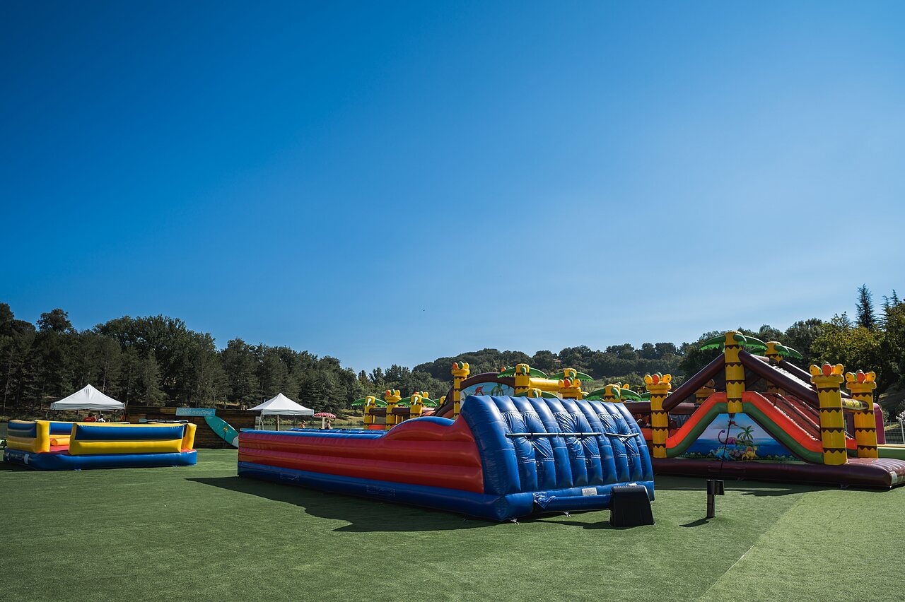 Giant inflatable games for children at CAPFUN Lac des 3 Vall�es campsite in Lectoure.