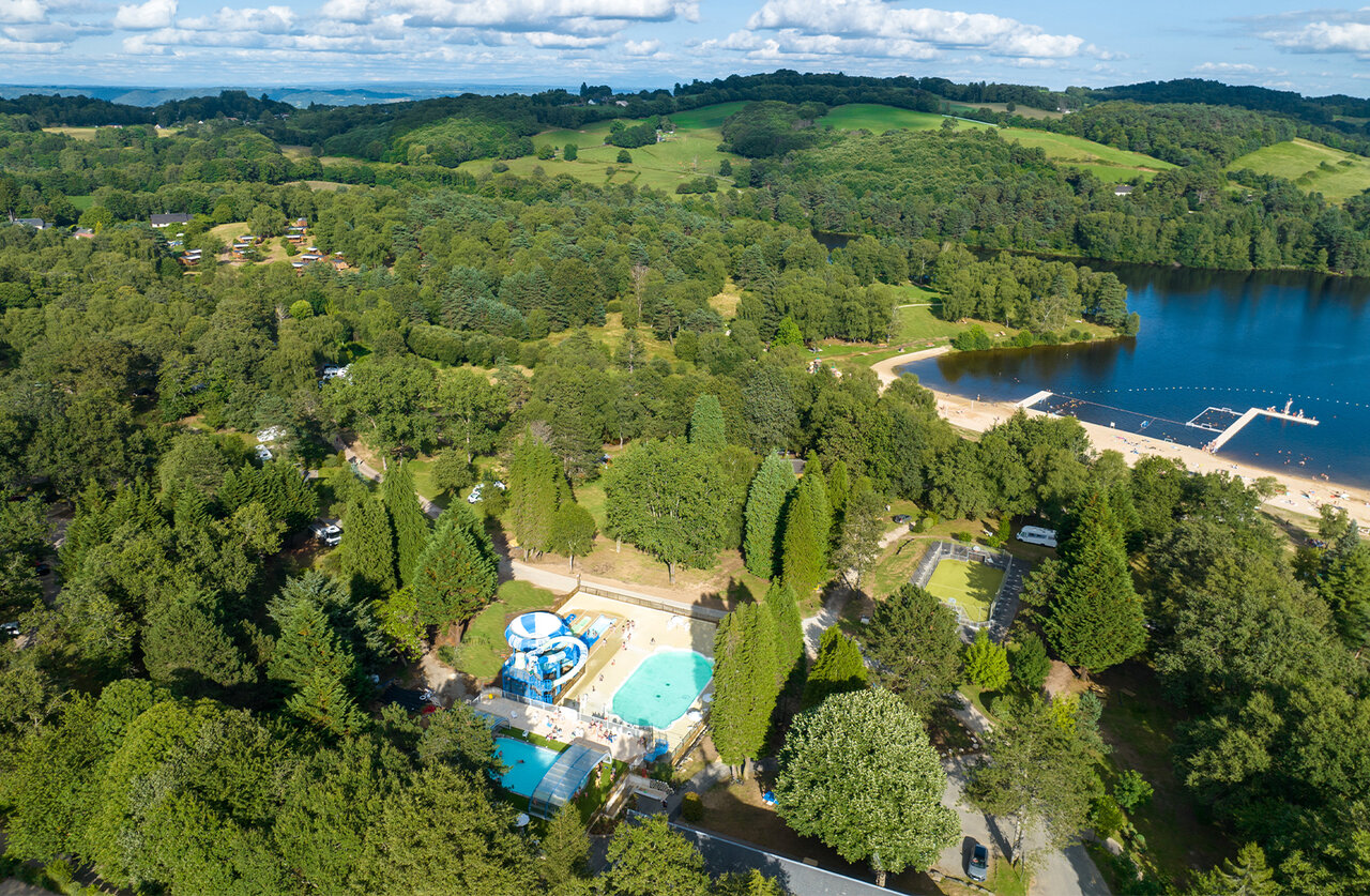 Swimming pool, waterslides, lake beach, aerial view at CLICOCHIC Lac de Miel campsite in Beynat (19).
