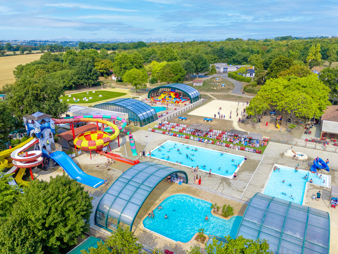 Giant slides, outdoor and indoor pools at CAPFUN Lac de Ribou campsite (49).