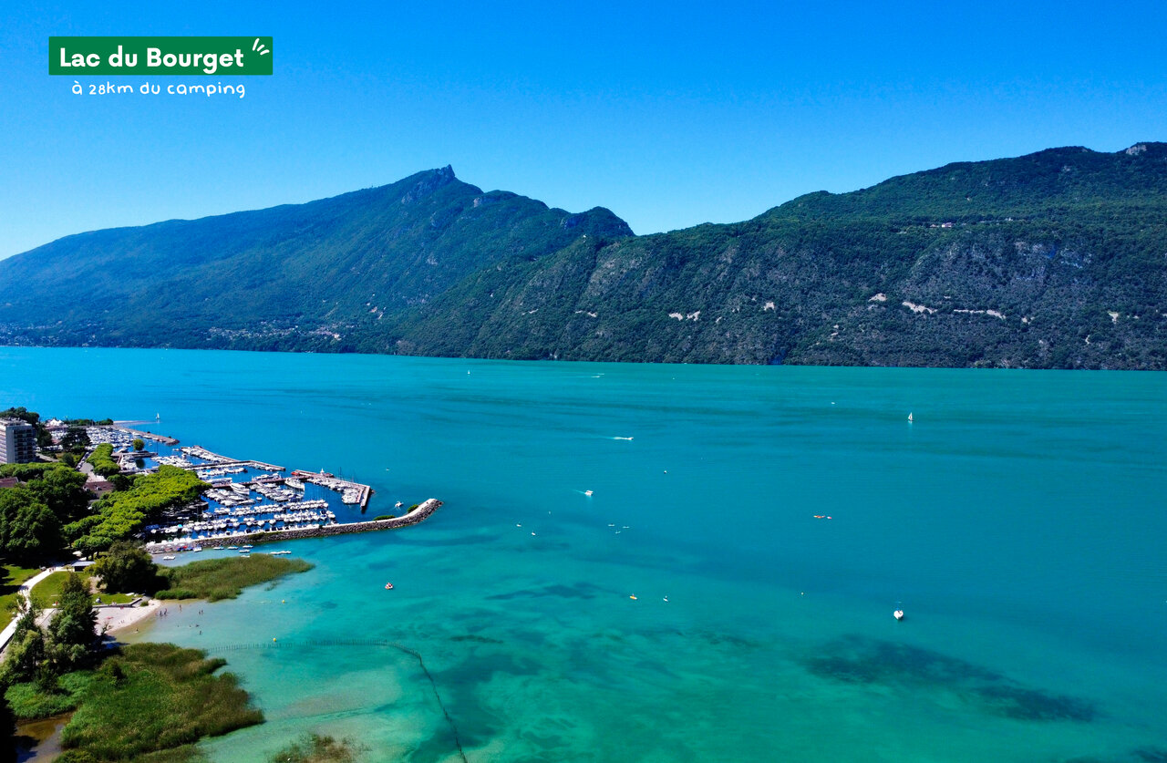 Lake Bourget, alpine lake with marina and mountains in Savoie.