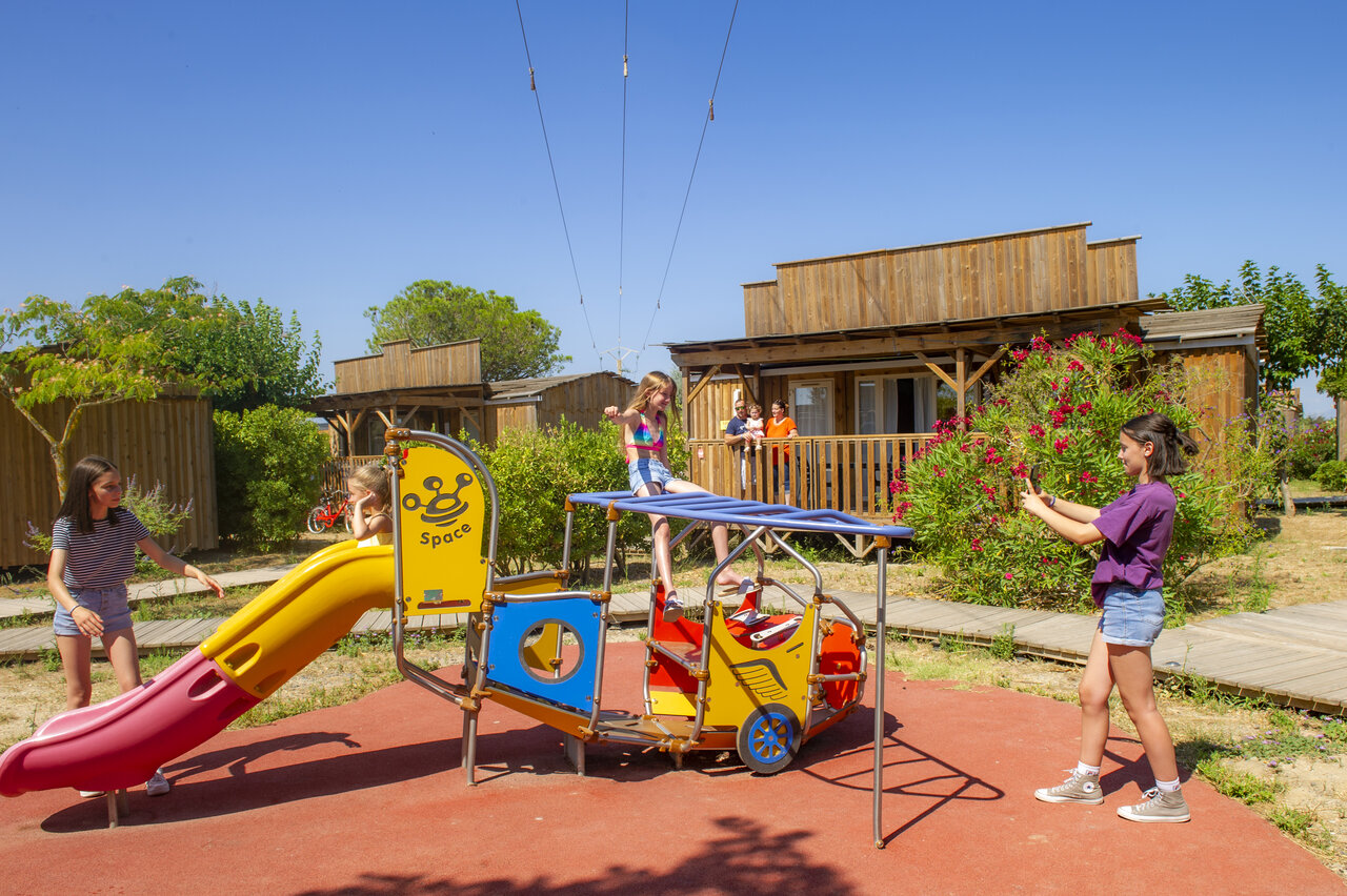 Playground with slide and climbing frame for children, CAPFUN Las Bousigues campsite.