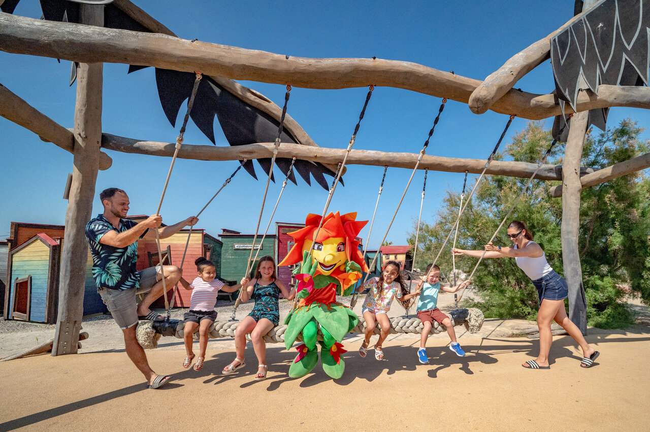 Giant swing, family and mascot at CAPFUN Las Bousigues campsite, Le Barcar�s.