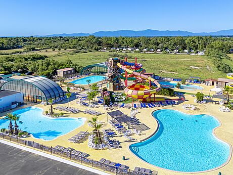 Colorful water slides and outdoor pools at CAPFUN Las Bousigues campsite in Le Barcar�s (66).