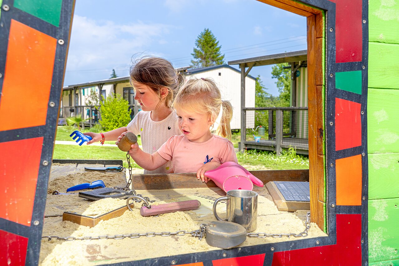 Children's sandpit at VAGUES OCEANES Les Iles campsite in Hudimesnil (50).