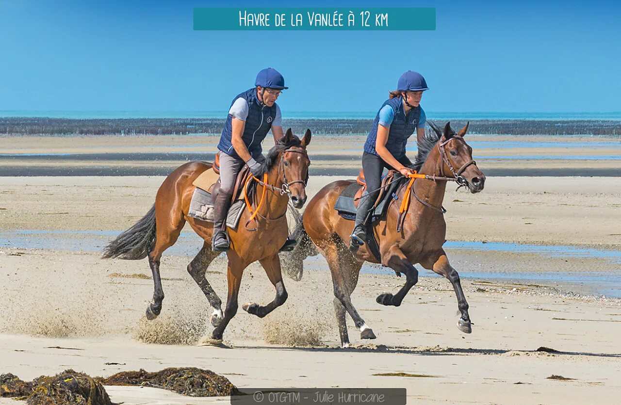 Horse riding on the beach of Havre de la Vanl�e, Normandy.