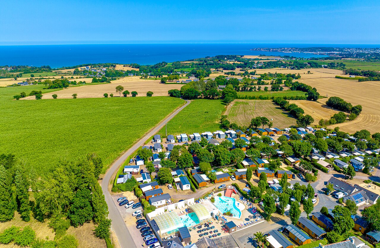 Aerial view campsite, Mobile homes, pool, slides at CLICOCHIC Bellevue d'Erquy campsite.