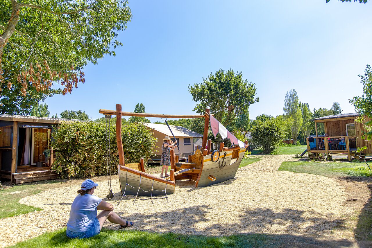 Pirate ship playground for children at CLICOCHIC Bellevue d'Erquy campsite.