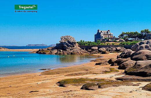 Fine sandy beach and pink granite rocks in Trégastel, Brittany.