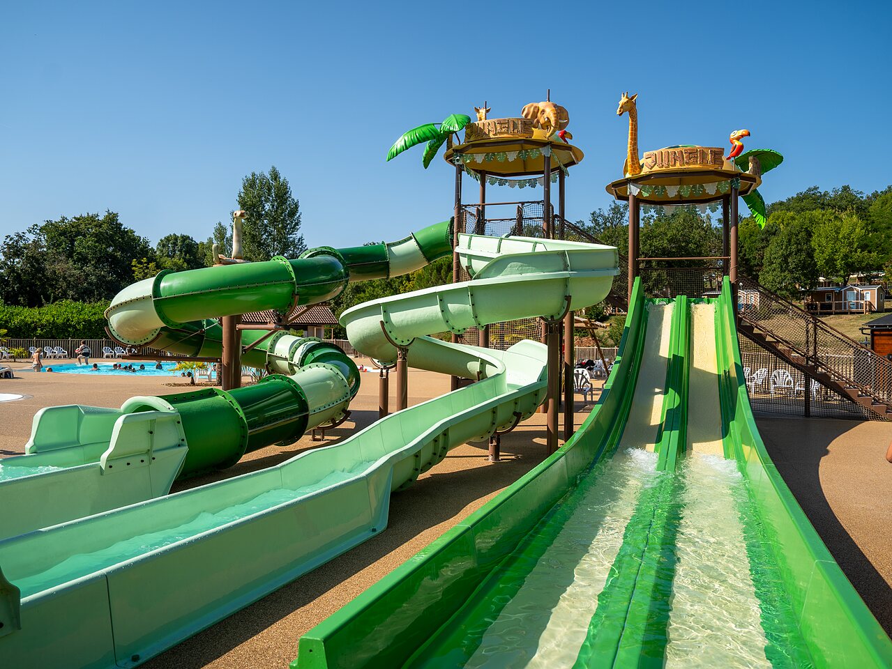 Water slides, pool at CLICOCHIC Les Secrets de Padirac campsite, Padirac (46).