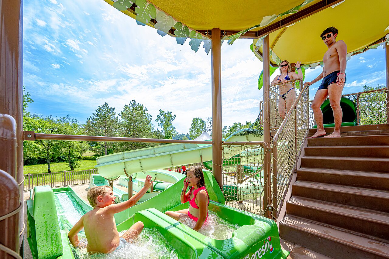 Water slides and play area at CLICOCHIC Les Secrets de Padirac campsite.