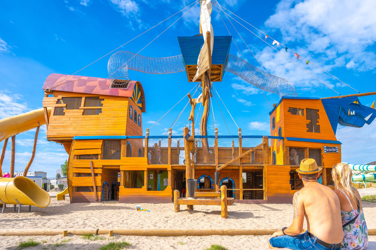 Giant pirate ship playground with slides at VAGUES OCEANES Licorne campsite in Dunkirk (59).
