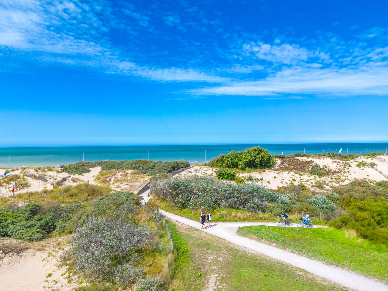 Sandy beach, dunes and cycling path at VAGUES OCEANES Licorne in Dunkerque (59).