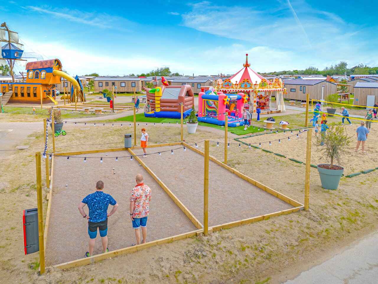 Petanque, pirate playground, bouncy castles at VAGUES OCEANES Licorne campsite Dunkerque.