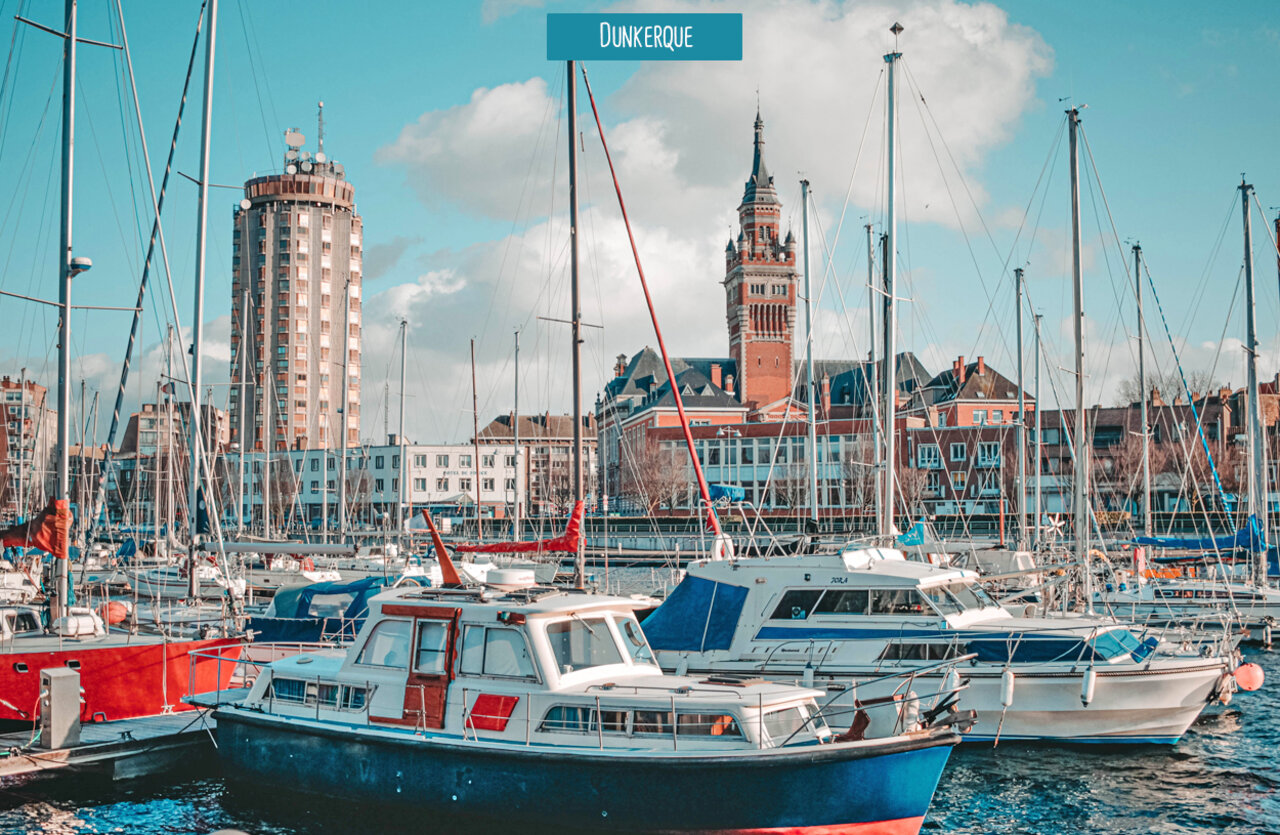 Dunkerque marina with boats and historic architecture, a city to visit.