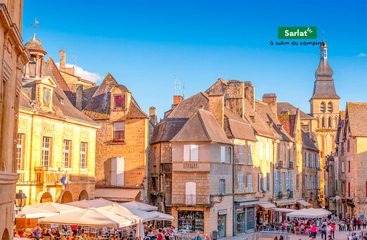 Sarlat, lively medieval town with restaurant terraces in Dordogne.