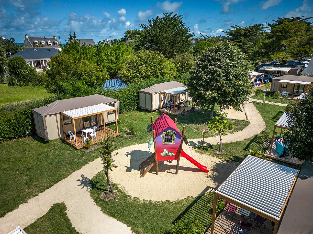 Aerial view campsite, accommodations and playground CLICOCHIC Longchamp Saint Lunaire (35).