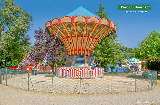 Chain carousel ride at Parc du Bournat, family attraction in Dordogne.