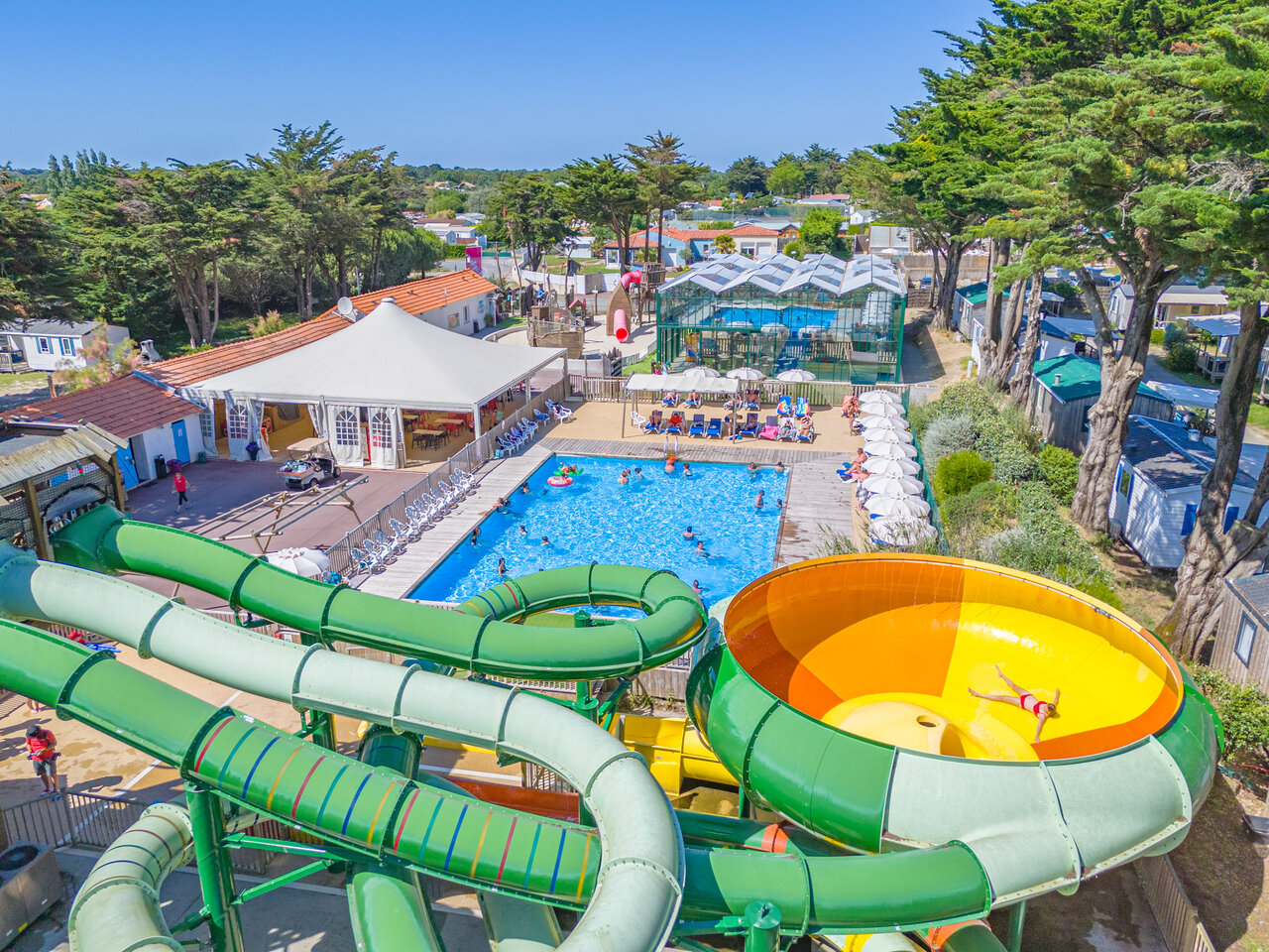 Outdoor pool, water slides and covered area at CAPFUN Madrague in PORNIC (44).