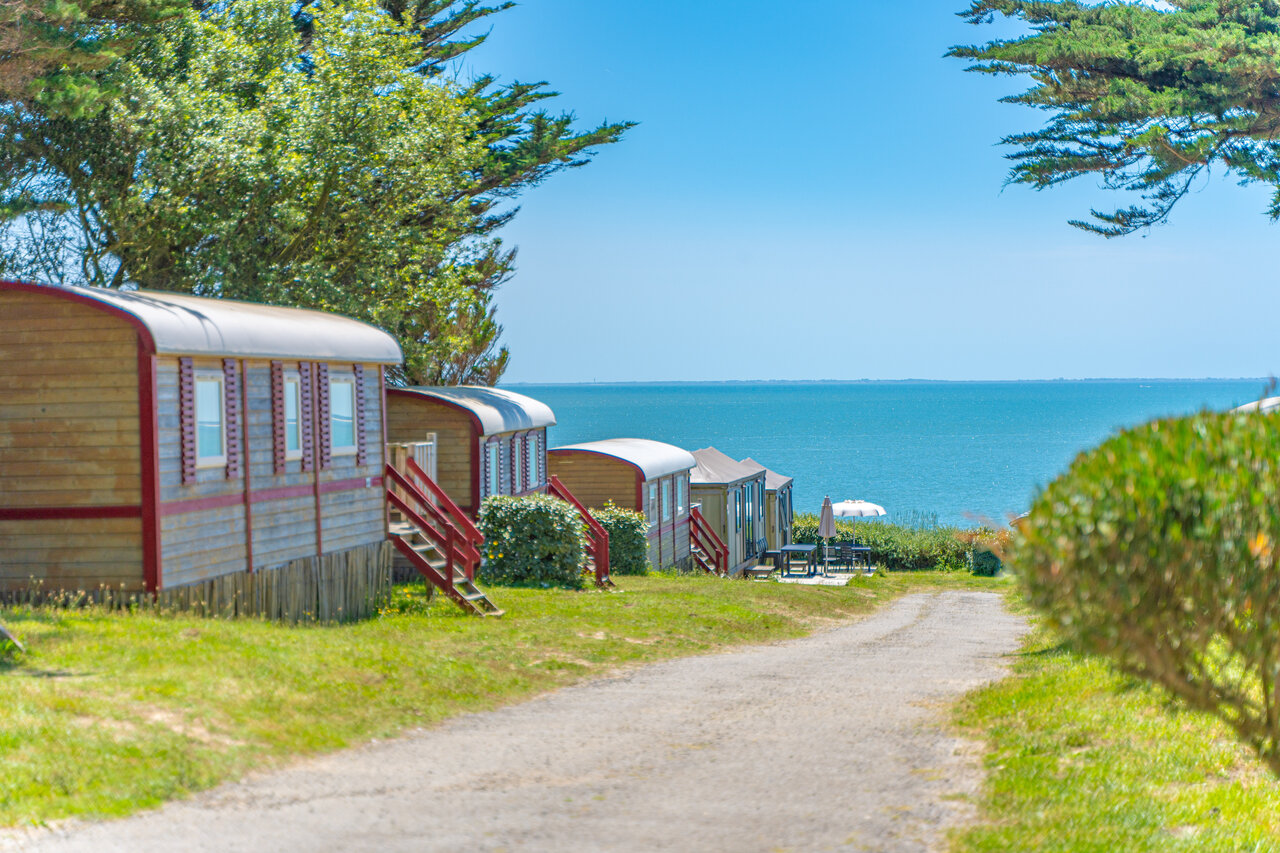 Wooden roulottes with sea view at CAPFUN Madrague campsite in PORNIC (44).