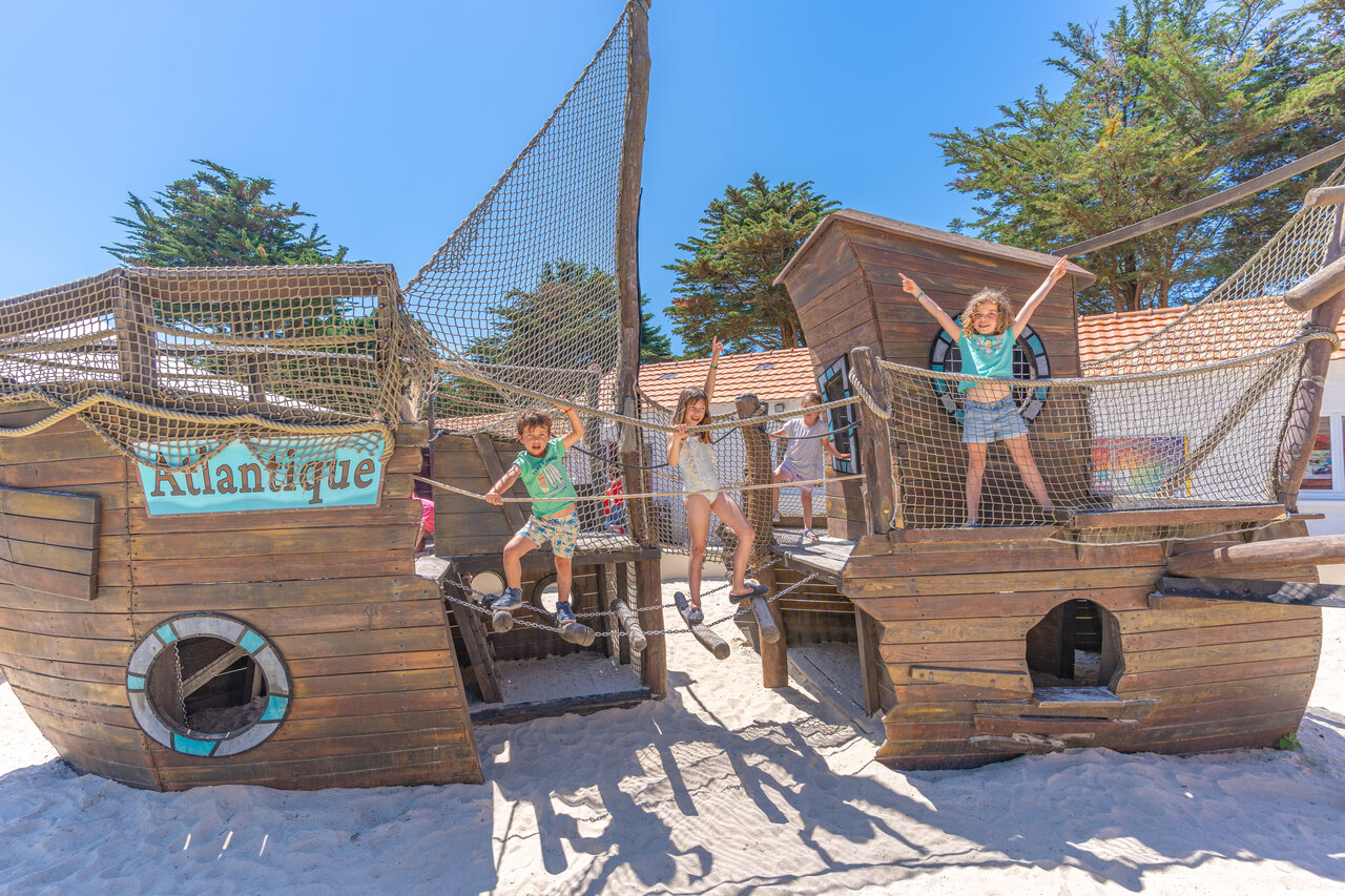 Pirate ship playground with happy kids at CAPFUN Madrague campsite in PORNIC (44).