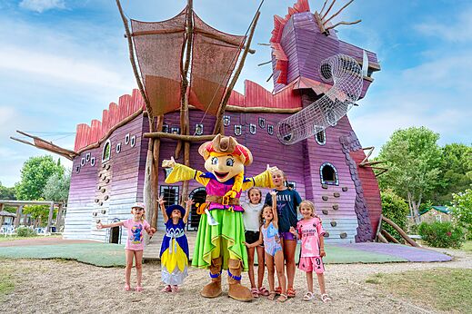 Dragon play structure, mascot and children, CAPFUN Mael campsite in ARGELES SUR MER (66).
