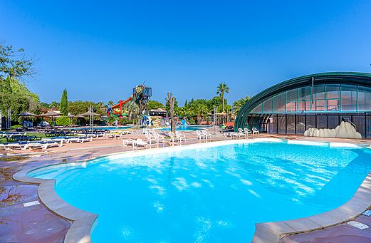 Outdoor swimming pool and water slides at CAPFUN Mael campsite in ARGELES SUR MER (66).