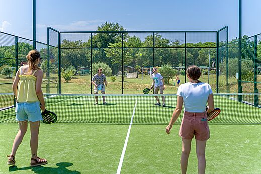 Padel court with players at CAPFUN Mael campsite in ARGELES SUR MER (66).