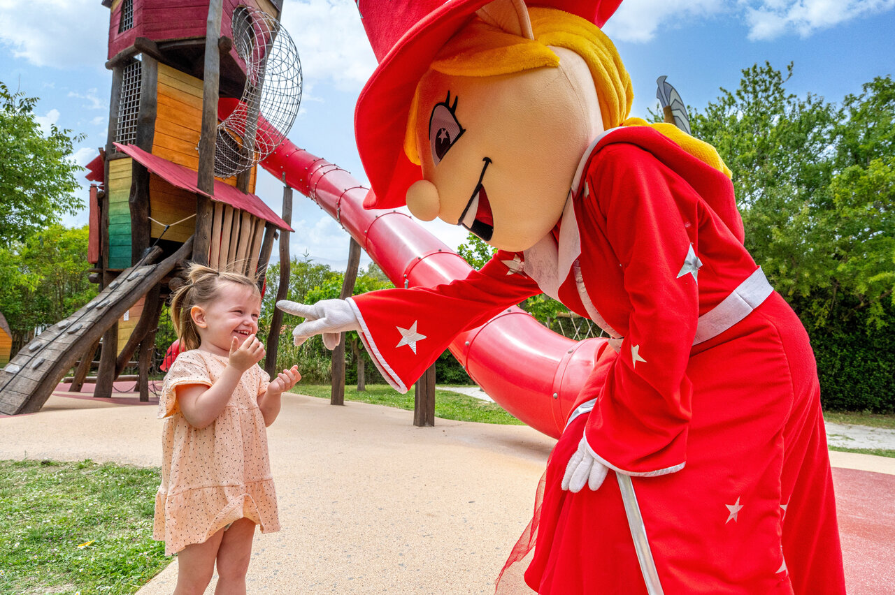 Mascot and child on playground, CAPFUN Malissonne campsite in LA CADIERE D'AZUR.