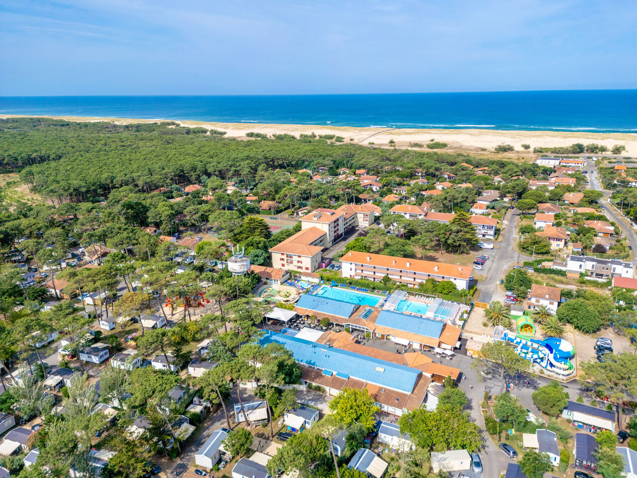 Aerial view of VAGUES OCEANES Marina Landes campsite, pools, Mobile homes and beach.