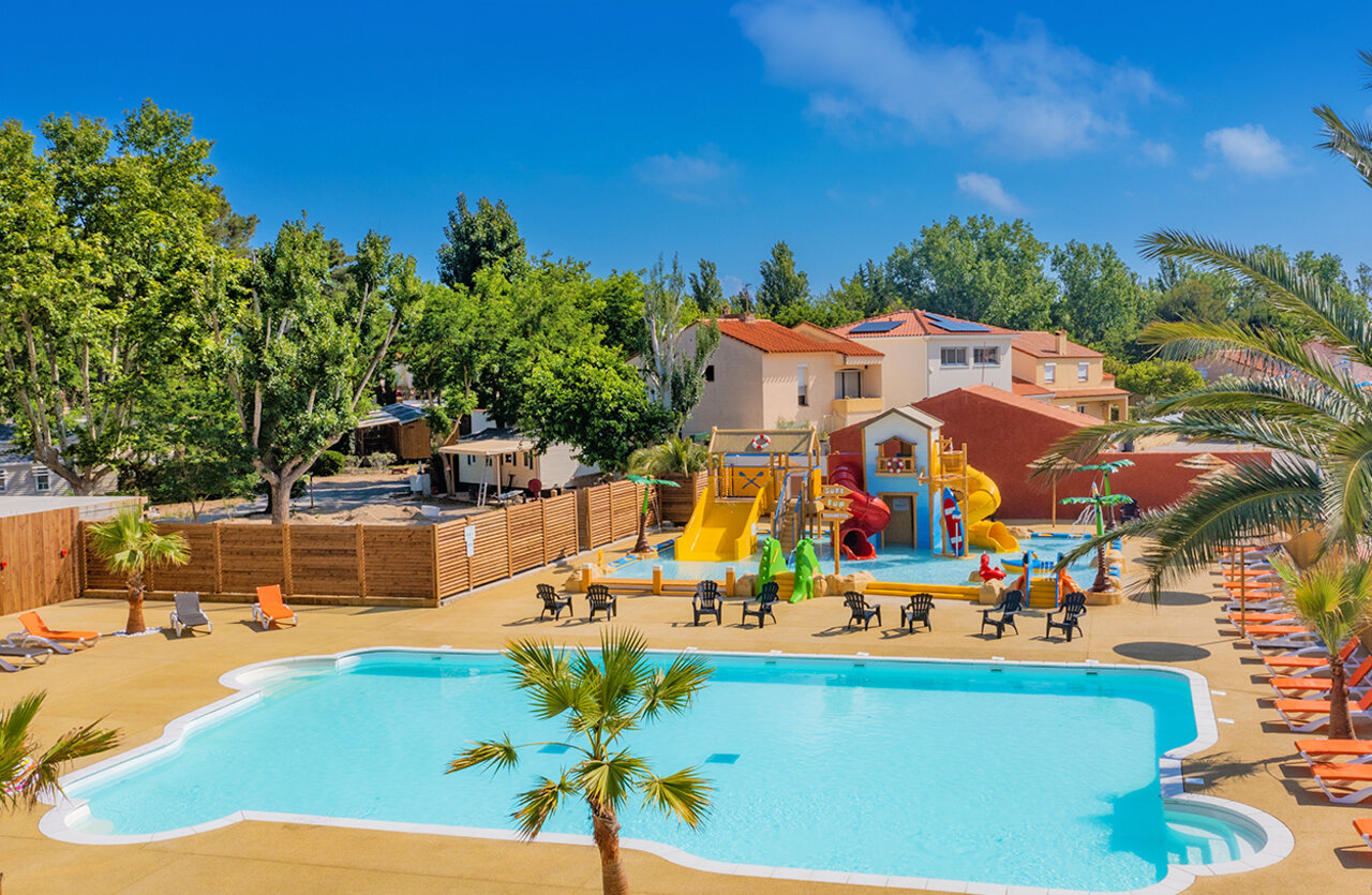 Large outdoor swimming pool and water park with slides at VAGUES OCEANES Marinette campsite in Ste Marie La Mer (66).