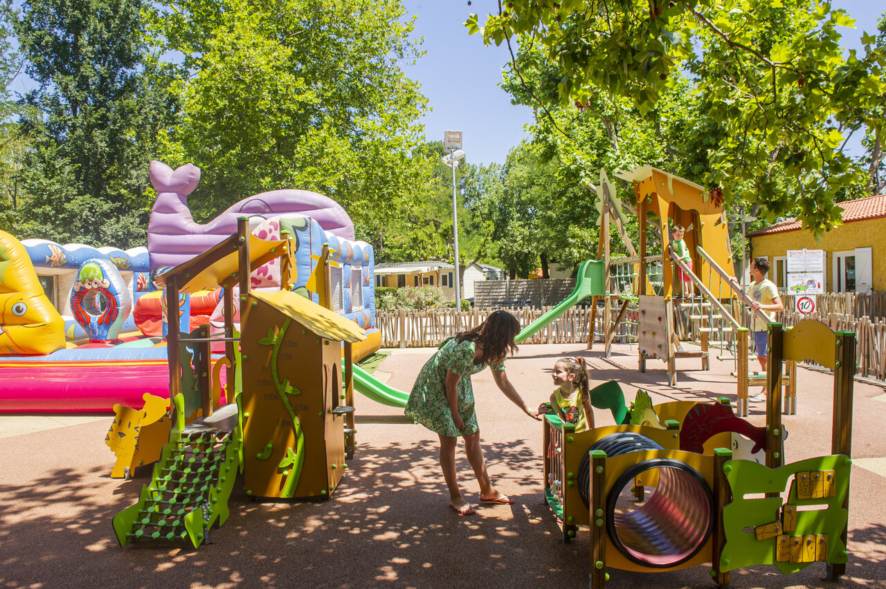 Playground with bouncy castles and slides at VAGUES OCEANES Marinette campsite in Ste Marie La Mer (66)