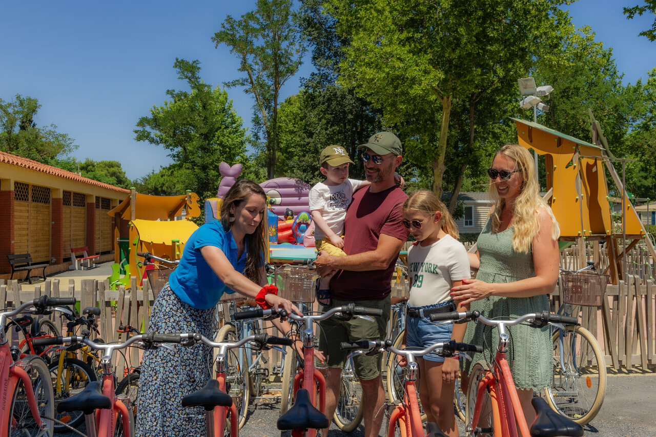 Family and bikes, playground at VAGUES OCEANES Marinette campsite in Ste Marie La Mer (66).