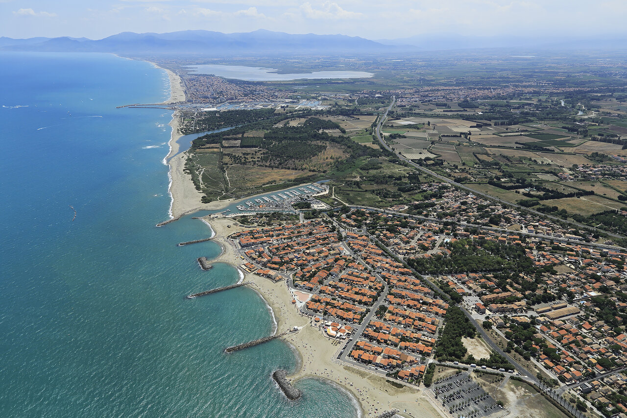 Aerial view coast, beaches, port at VAGUES OCEANES Marinette campsite in Ste Marie La Mer (66).