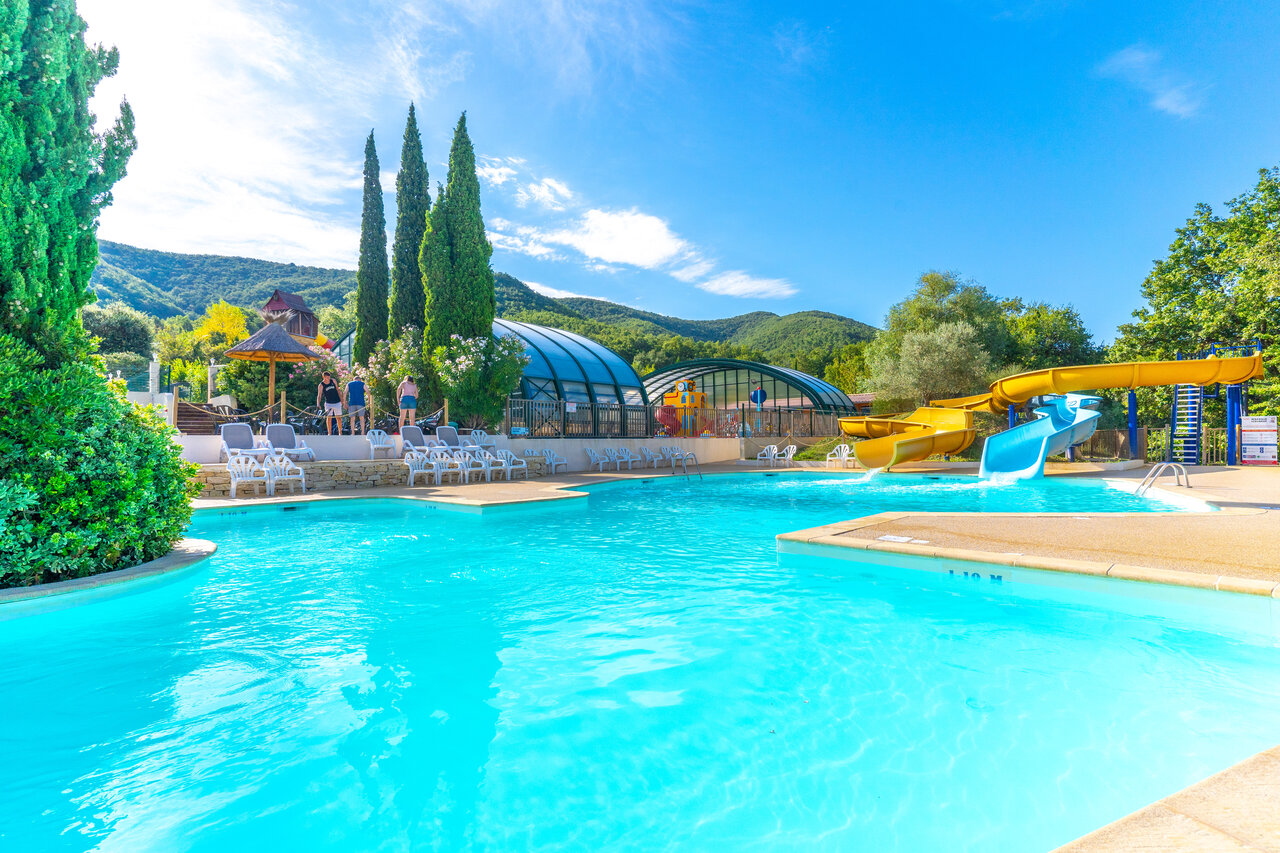 Outdoor pool, water slides, covered pools at CAPFUN Merle Roux campsite in Baix (07).