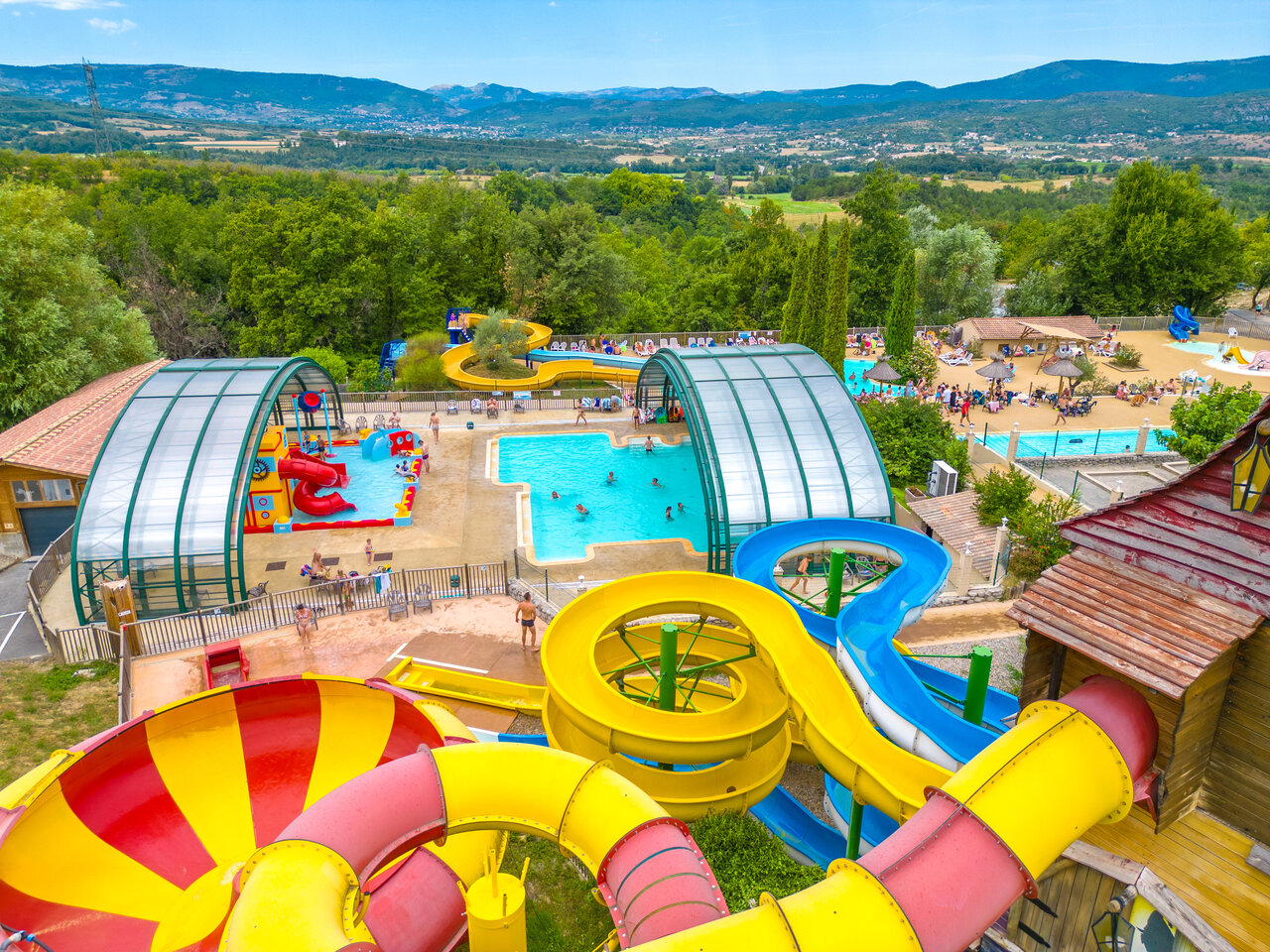 Water park, giant slides and pools at CAPFUN Merle Roux campsite, Baix (07).