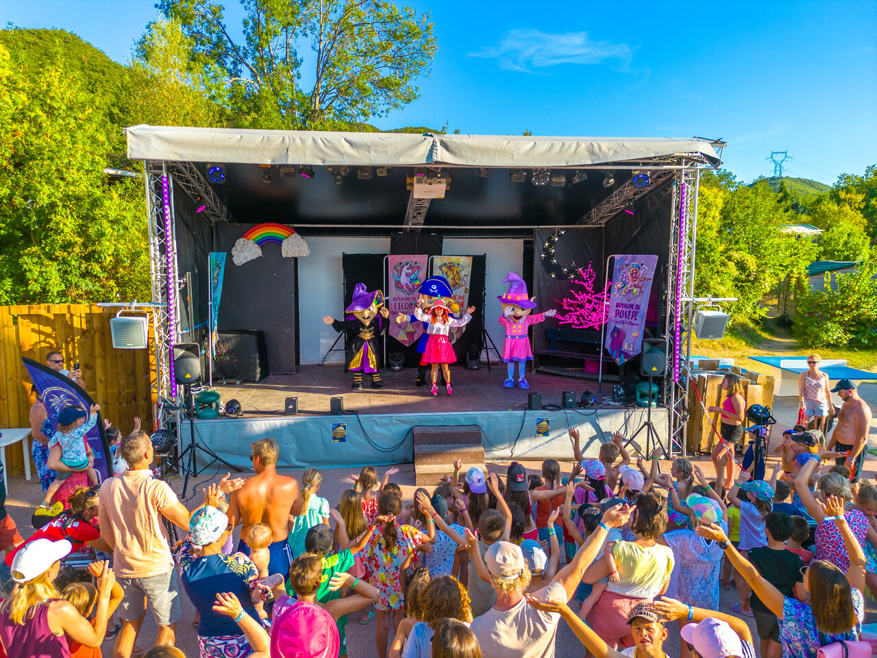 Animation show with characters and children at CAPFUN Merle Roux campsite in Baix (07).
