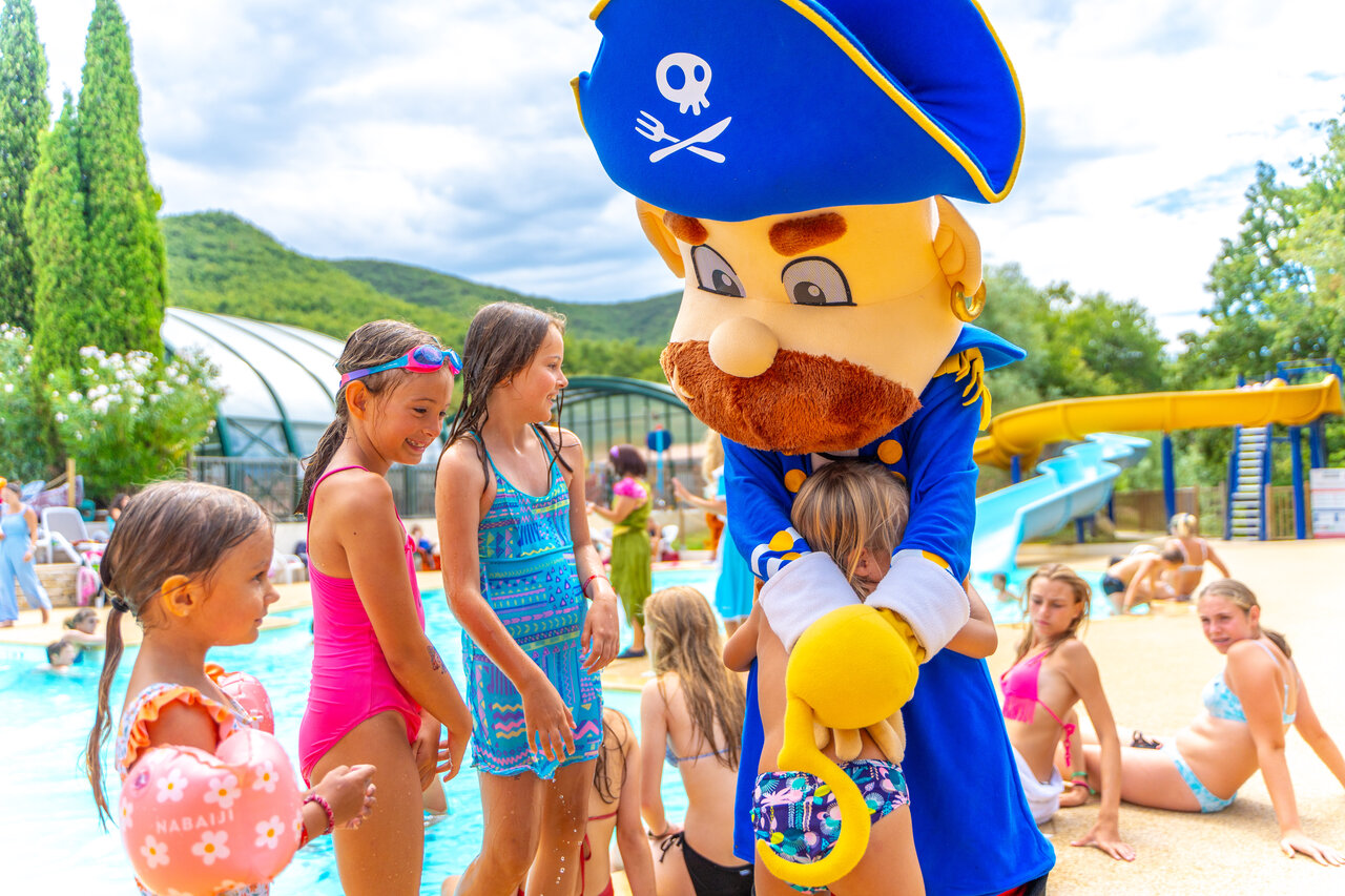 Pirate mascot, children, pool at CAPFUN Merle Roux campsite in Baix (07).