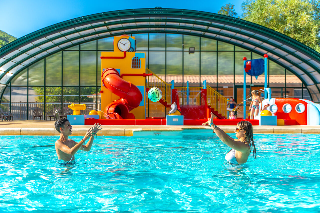 Swimming pool, slide and water games at CAPFUN Merle Roux campsite in Baix (07).