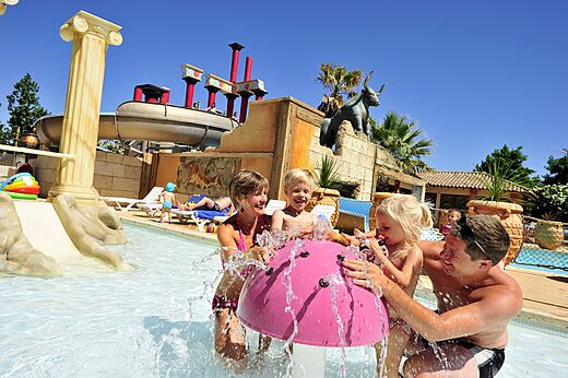 Happy family water games pool CAPFUN Mer et Soleil campsite Cap d'Agde.
