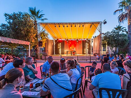 Stage entertainment with audience at CAPFUN Mer et Soleil campsite, Cap d'Agde (34).