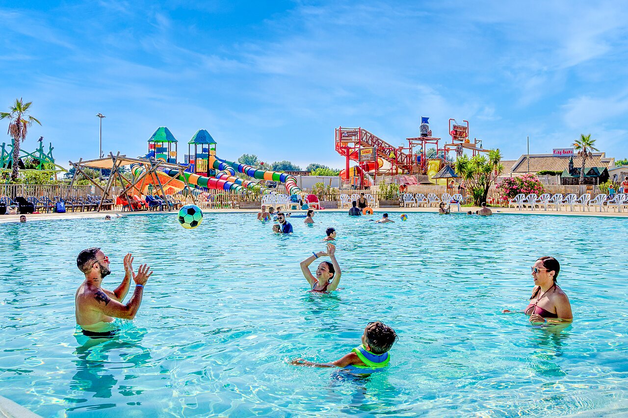 Outdoor pool, slides and water games at CAPFUN Mille P�pites campsite in Carnon (34).